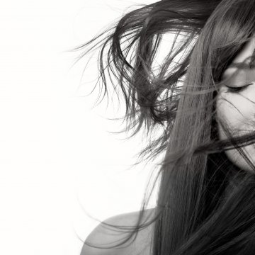 hair dryer bio ionic 10x ultralight speed happy womab with beautiful long brown hair closed eyes white background